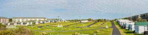 A panoramic view of the red and yellow and red sections taken from atop the sand dunes.